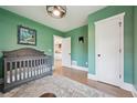 Neutral Bedroom with soft light and hardwood floors at 4504 N Clay St, Denver, CO 80211