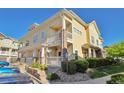 Exterior view highlighting a two-story building with manicured landscaping and accessible entrance at 9429 Ashbury Cir # 101, Parker, CO 80134