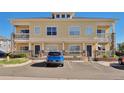 Attractive exterior featuring a two-story facade with covered front porches and dedicated parking spaces at 9429 Ashbury Cir # 101, Parker, CO 80134
