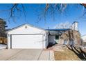 Charming single-story home features a two-car garage, brick walkway, and a well-maintained front yard at 2719 S Truckee St, Aurora, CO 80013