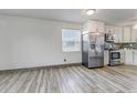 Kitchen featuring stainless steel appliances and white cabinets, creating a bright and functional space at 1135 S Gilbert St # 103, Castle Rock, CO 80104