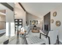 Inviting living room featuring vaulted ceilings, fireplace, and comfortable seating, perfect for relaxation and entertainment at 2201 Juniper Ct, Boulder, CO 80304