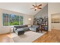 L-shaped sectional sofa in a living room with hardwood floors at 2975 Thunder Lake Cir, Lafayette, CO 80026