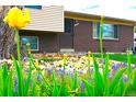 Inviting home exterior with vibrant flowerbeds enhancing the curb appeal, and adding natural beauty at 11823 Williams Way, Northglenn, CO 80233