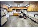 Spacious garage featuring built-in cabinets and ample storage space for tools and equipment at 11823 Williams Way, Northglenn, CO 80233