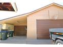 Spacious garage with brown garage door and basketball hoop attached at 11823 Williams Way, Northglenn, CO 80233