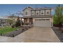 Charming two-story home with landscaped front yard, covered porch and attached two car garage at 16400 Alberta Dr, Parker, CO 80134