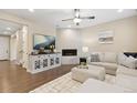 Inviting living room features a cozy fireplace, stylish console, and comfortable seating at 16400 Alberta Dr, Parker, CO 80134