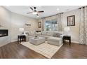 Comfortable living room featuring an oversized sectional sofa, area rug, and modern decor at 16400 Alberta Dr, Parker, CO 80134