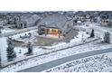 Back exterior showcasing a covered patio and fenced yard, ideal for outdoor enjoyment and privacy at 1060 Arrowhead Ct, Erie, CO 80516