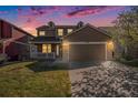 Charming two-story home with a spacious front yard and a two-car garage with stone details at 11748 Mill Valley St, Parker, CO 80138