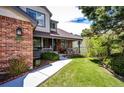 Lovely home with a brick facade, a covered porch, and manicured landscaping leading to the front entrance at 6762 Eagle Pl, Highlands Ranch, CO 80130