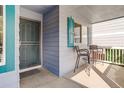 Inviting front porch features seating area for enjoying the outdoors at 354 Willowick Cir, Highlands Ranch, CO 80129