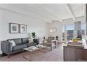 Cozy living room features a modern aesthetic, stylish decor, and plenty of natural light at 1441 N Humboldt St # 505, Denver, CO 80218