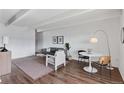 Open living room with wood floors, stylish decor, and a designated dining area at 1441 N Humboldt St # 505, Denver, CO 80218