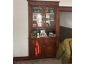 A built in cabinet with many glass decor items at 4536 Beach Ct, Denver, CO 80211