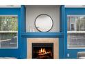A close up of the fireplace, which features a mantel and a tile surround at 21950 E Crestline Ln, Aurora, CO 80015