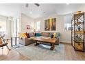 Bright living room with hardwood floors, modern furniture, and an open concept design at 4537 N Tennyson St # 101, Denver, CO 80212