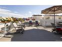 Stylish rooftop patio with outdoor seating, planters, and a cozy atmosphere at 4537 N Tennyson St # 101, Denver, CO 80212