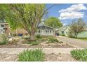 Charming bungalow with mature landscaping featuring mature trees and unique plants at 280 Pierce St, Erie, CO 80516