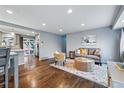 Comfortable living room with hardwood floors, recessed lighting and open access to kitchen at 2958 E Euclid Pl, Centennial, CO 80121