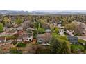 Panoramic aerial view of homes nestled among mature trees, offering a sense of community at 7282 S Vance St, Littleton, CO 80128
