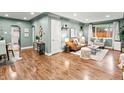 Spacious living room with modern decor, wood floors, and plenty of natural light at 3555 Leyden St, Denver, CO 80207