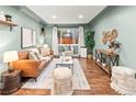Bright living room with wood floors, stylish decor, and ample seating at 3555 Leyden St, Denver, CO 80207