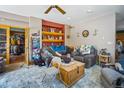 Comfortable living room with plush seating, a wooden coffee table, and built-in shelves at 6100 Bear Paw Rd, Golden, CO 80403