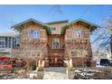 Charming exterior view showcasing the unique brick architecture and the colorful trees surrounding the property at 861 N Humboldt St # A, Denver, CO 80218