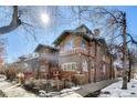 Stylish brick exterior showcasing the design, large windows, and landscaping of this attractive property at 861 N Humboldt St # A, Denver, CO 80218