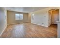 Open floor plan with hardwood floors, natural light, and neutral walls at 7243 S Millbrook Ct # F, Aurora, CO 80016