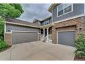 Charming two-story home featuring stone accents, attached garage, and a welcoming porch at 1839 Caleta Trl, Longmont, CO 80504