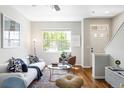 Bright living room featuring hardwood floors, neutral walls, with lots of natural light from a large window at 7440 E 8Th Ave # 25, Denver, CO 80230