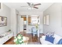 Cozy living room with hardwood floors, neutral walls, and lots of natural light and open to the kitchen at 7440 E 8Th Ave # 25, Denver, CO 80230