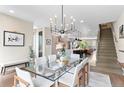 Bright dining room with modern chandelier, open floor plan, and contemporary decor at 3885 Vrain St, Denver, CO 80212
