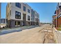 Modern townhome exterior with brick accents, large windows, and sleek contemporary design at 9081 Westminster Blvd, Westminster, CO 80031