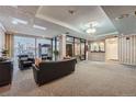 Cozy condo lobby featuring striped wall paper, seating, and large windows at 1313 Steele St # 606, Denver, CO 80206