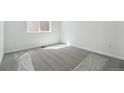Bedroom showcasing neutral carpet, bright white walls, and a window with natural light at 9141 Telluride Ct, Commerce City, CO 80022