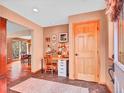 Inviting entryway features a study desk and unique tile flooring, with a dining room view at 30813 Kings Valley Dr, Conifer, CO 80433