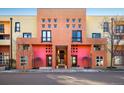 Striking multi-colored building facade with a unique architectural design and inviting entryway at 801 Confidence Dr # 2, Longmont, CO 80504