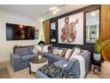 Comfortable living room featuring stylish decor, large sectional, and a cozy fireplace at 801 Confidence Dr # 2, Longmont, CO 80504