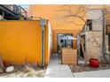 Inviting outdoor patio area with modern table, umbrella and privacy screen for relaxing or entertaining guests at 801 Confidence Dr # 2, Longmont, CO 80504