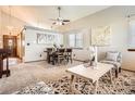 Open-concept living and dining area with modern decor, ample natural light, and comfortable seating at 6367 Xavier St, Arvada, CO 80003