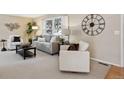 Comfortable living area with neutral colors, large windows, and stylish decor at 4702 E Costilla Ave, Centennial, CO 80122