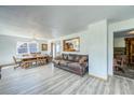 Open living space with wood floors and a seamless flow to the dining area at 234 Carroll Ln, Breckenridge, CO 80424