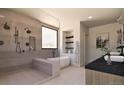 Luxurious bathroom with a soaking tub, walk-in shower, and elegant fixtures, a private oasis at 5326 Lions Paw St, Castle Rock, CO 80104