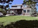 Large backyard with patio and pergola, perfect for outdoor entertaining at 7408 Sodalite Way, Castle Rock, CO 80108