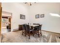 Dining room area featuring carpet, a dining table, and bright walls at 3823 S Uravan St, Aurora, CO 80013