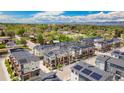 Community featuring modern townhomes with solar panels and manicured landscaping at 7808 W 43Rd Pl, Wheat Ridge, CO 80033